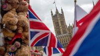 Products sit on a souvenir stall in view of the Houses of Parliament in London on Oct. 13, 2020